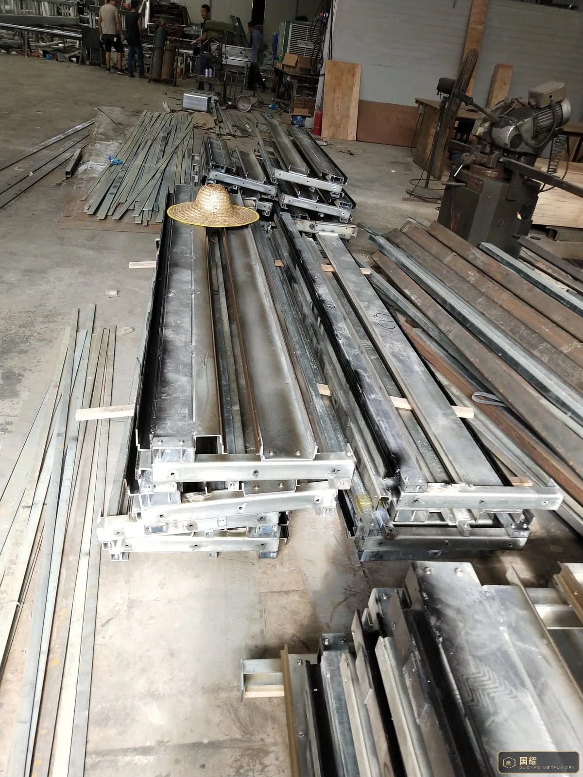 Close view of the end of a facade frame showing cleats, brackets and fixing slots